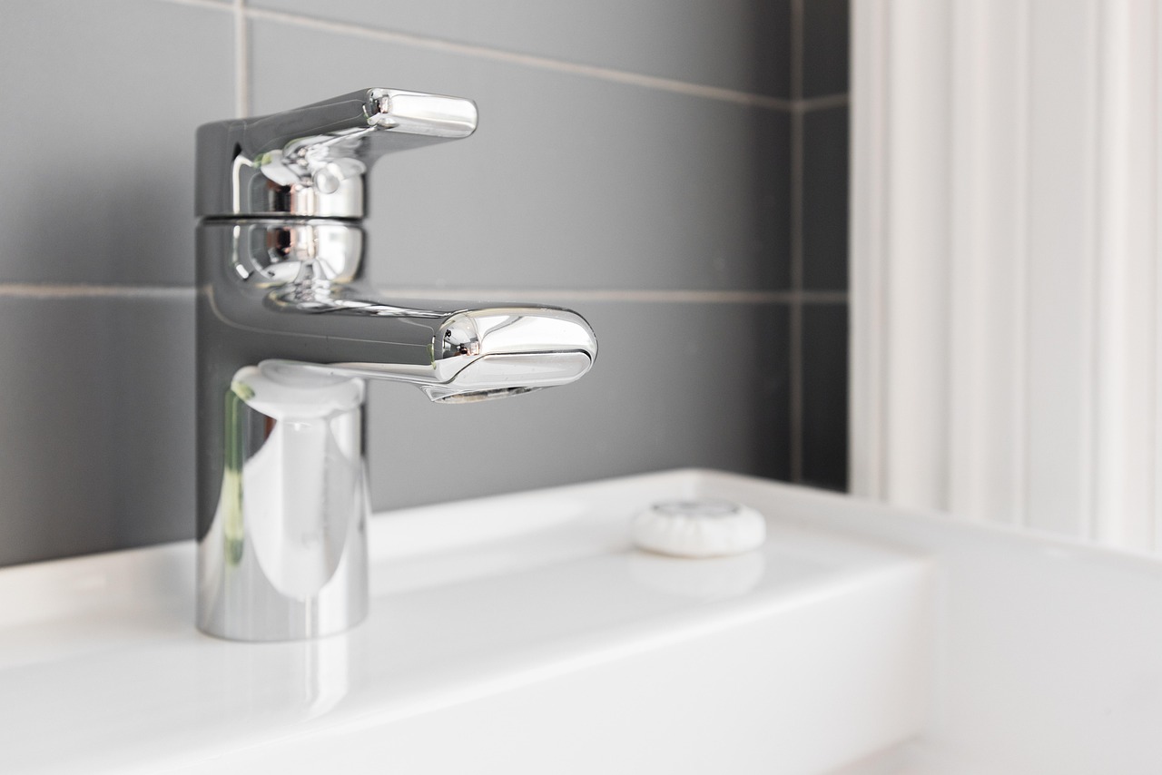 Modern bathroom faucet representing common leaking or dripping issues.